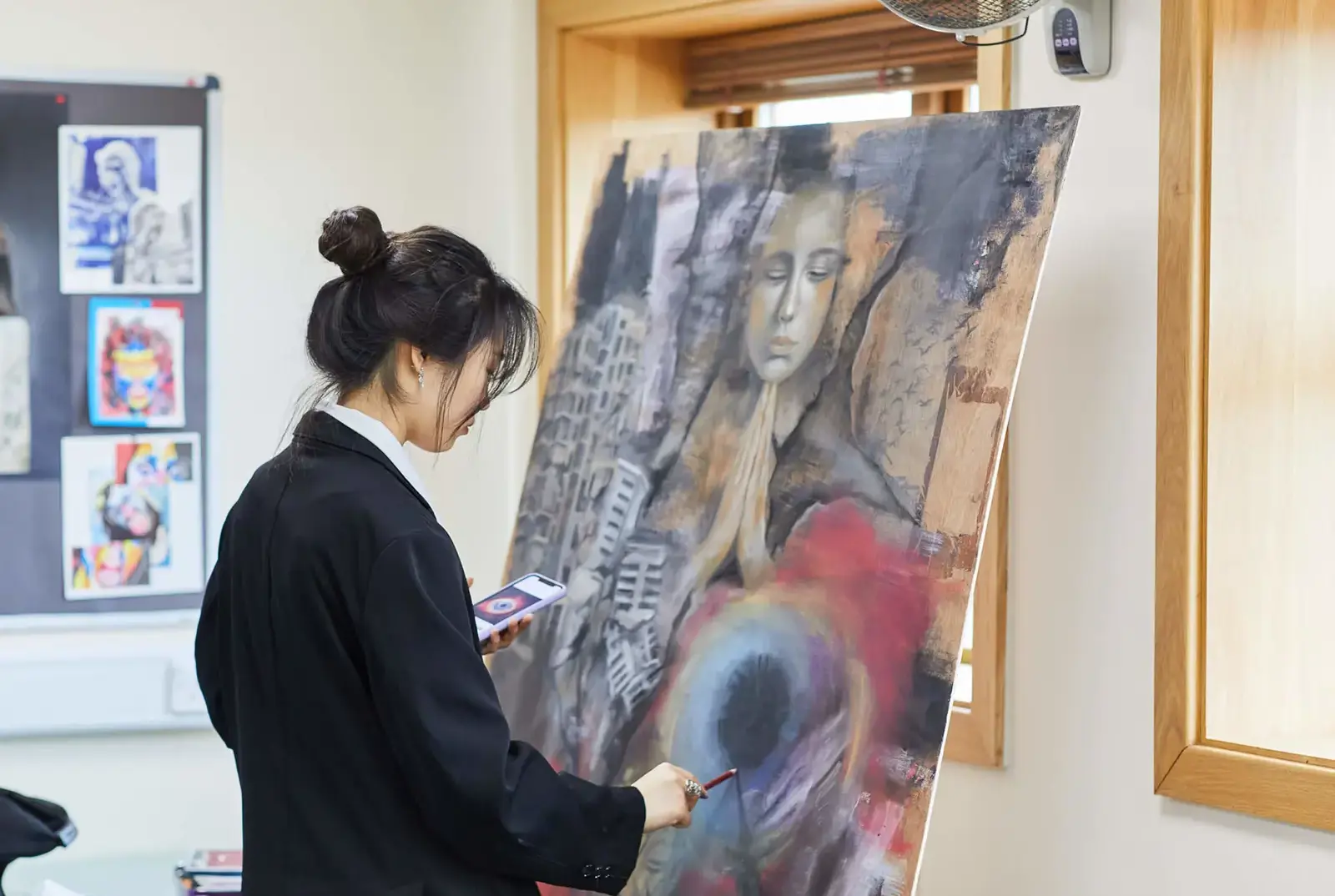 International student at QE College in art class