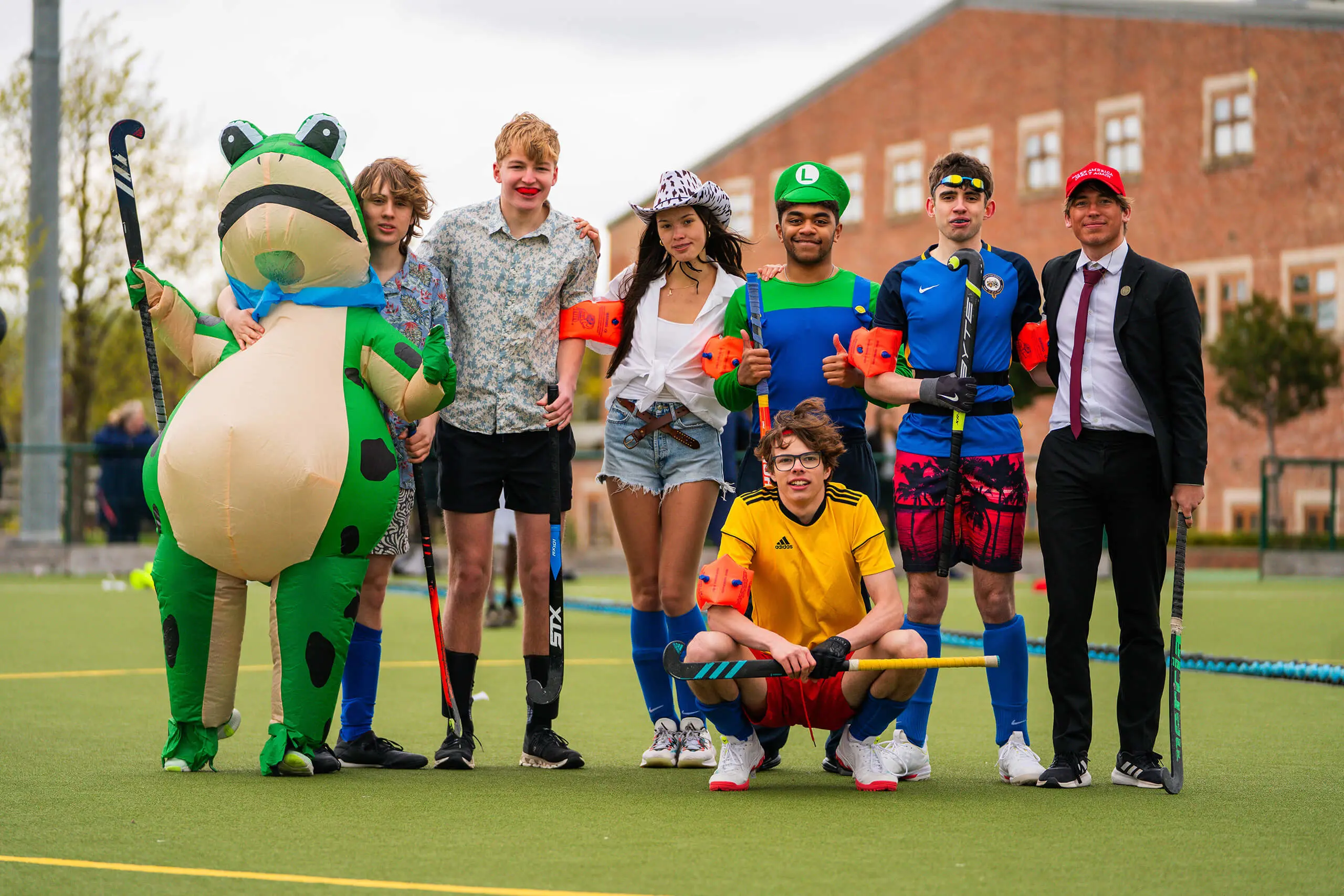 Queen Ethelburga's students competing in a fancy dress hockey match.