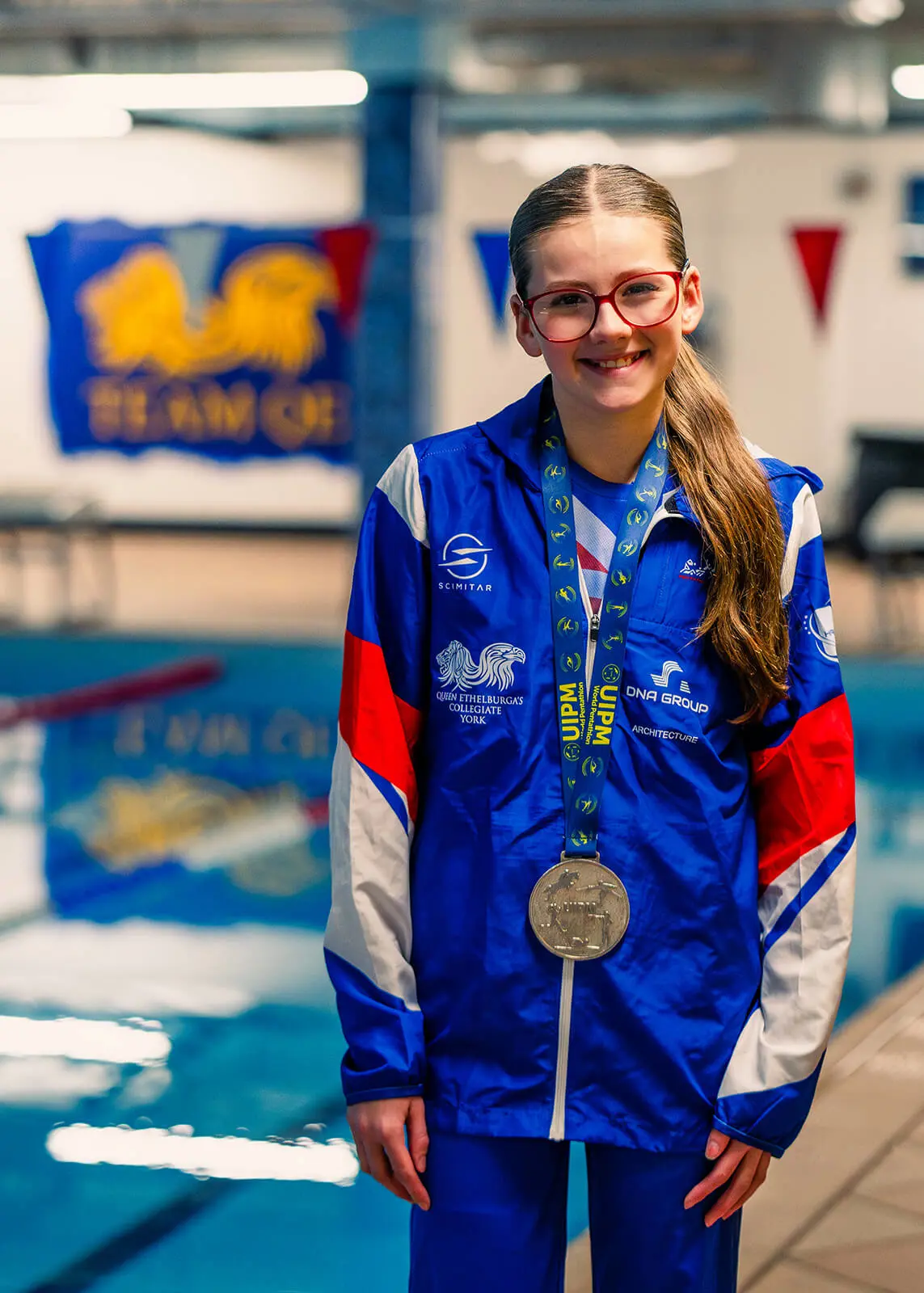 A Key Stage 3 King's Magna student celebrating her competitive swimming success