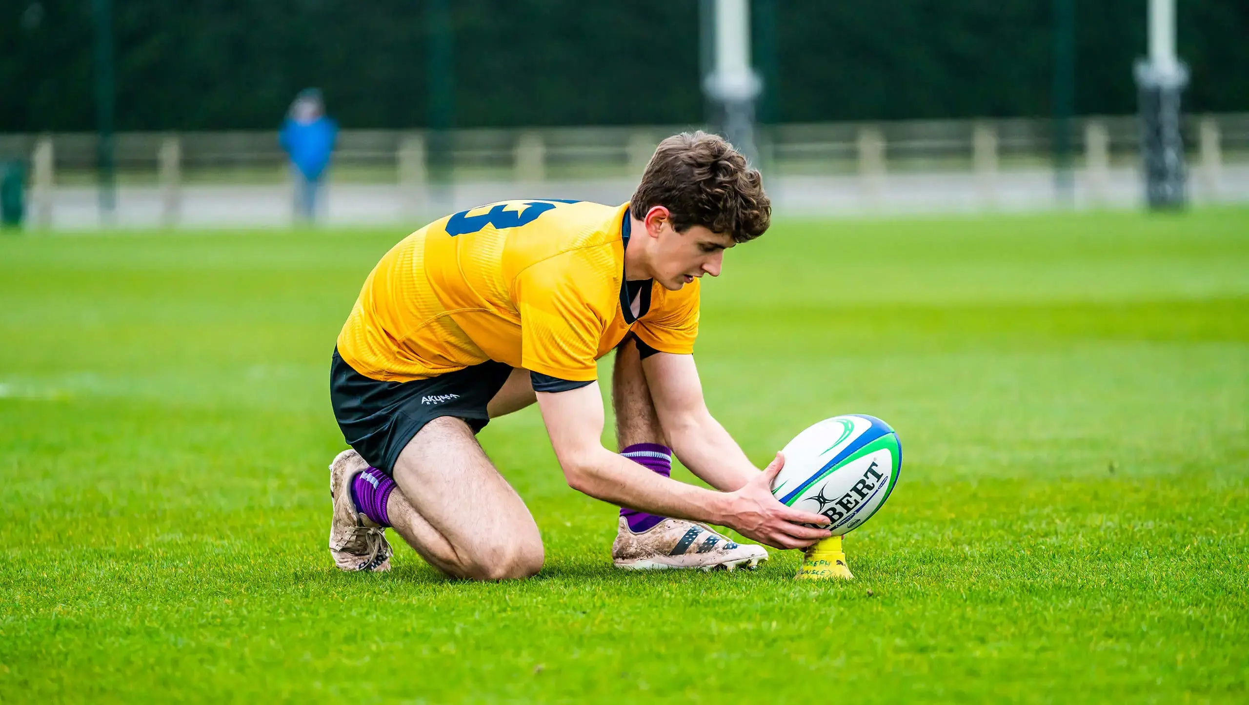QE pupil playing rugby