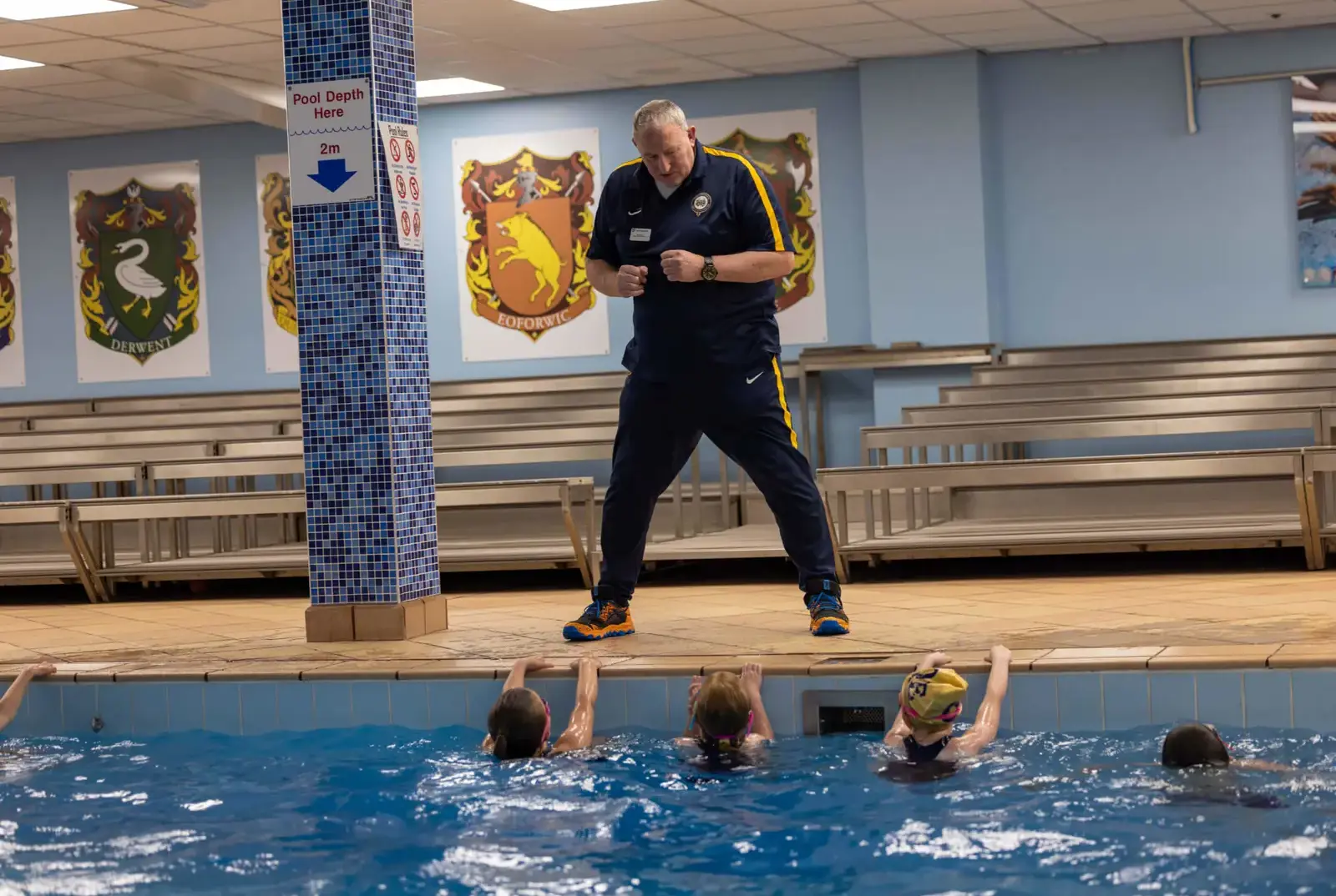 Chapter House pupils in swimming lesson taught by dedicated swimming coach.
