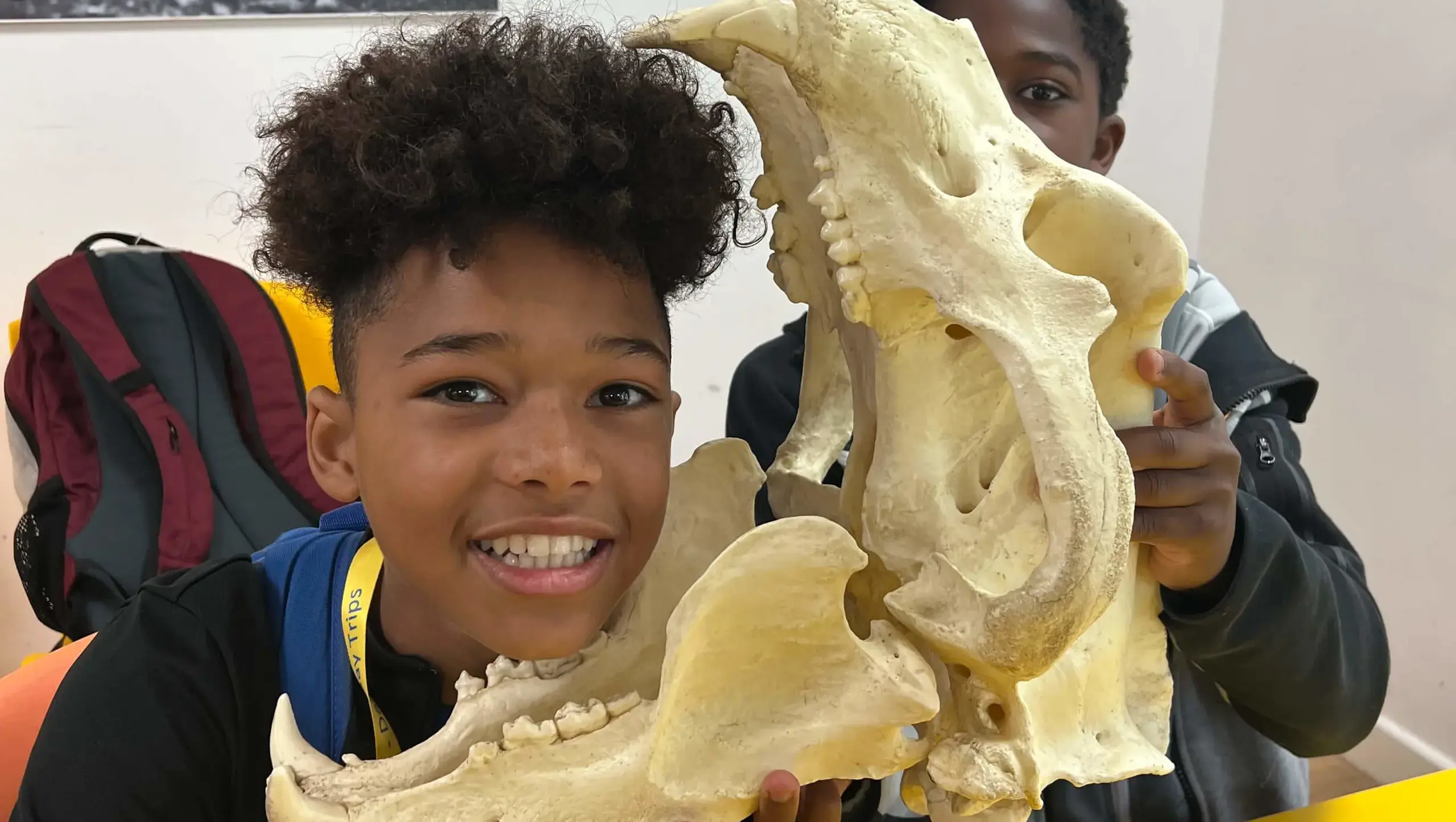 King's Magna pupils on a school trip, playing with a carnivore skull