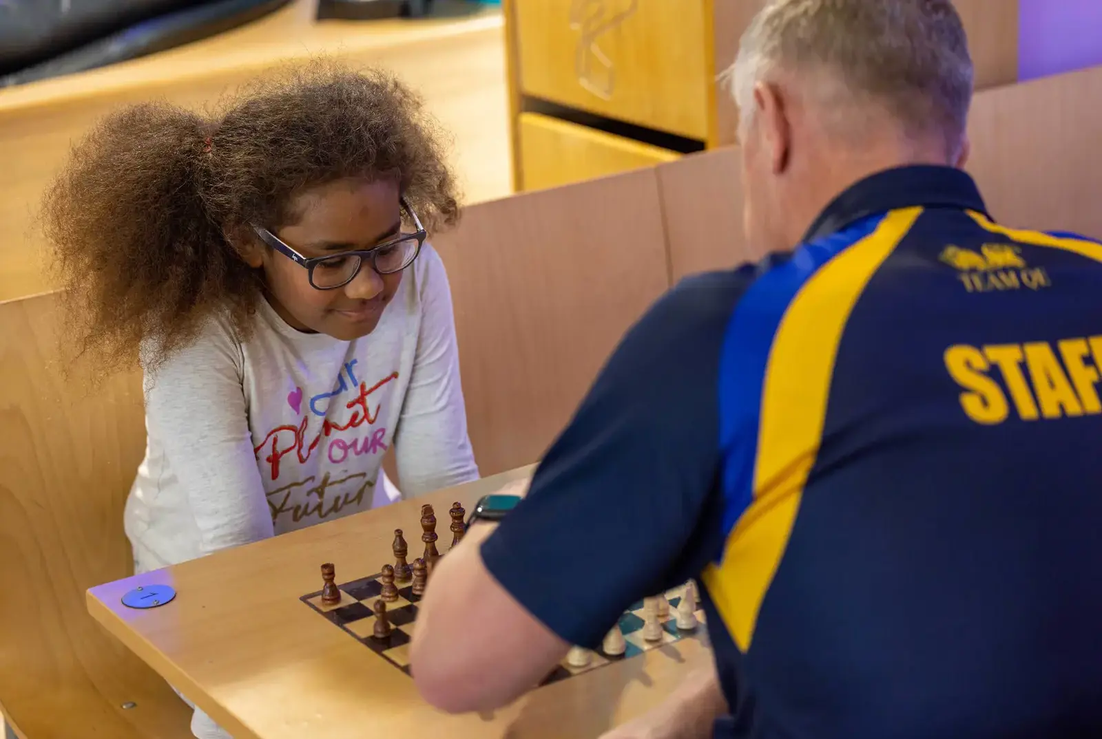 Chapter House pupil playing chess with a teacher