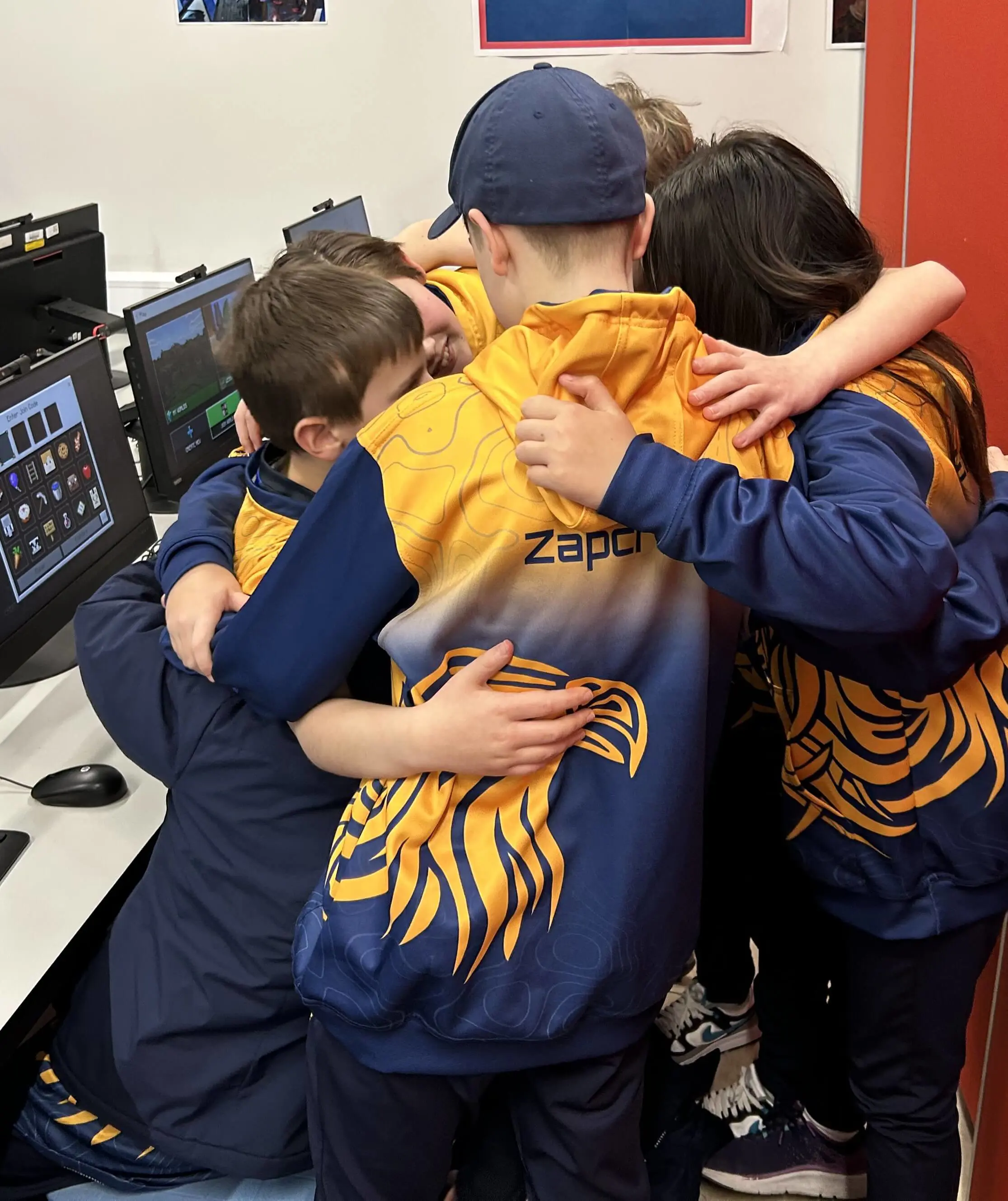 The Minecraft team hugging before the live final begins. 