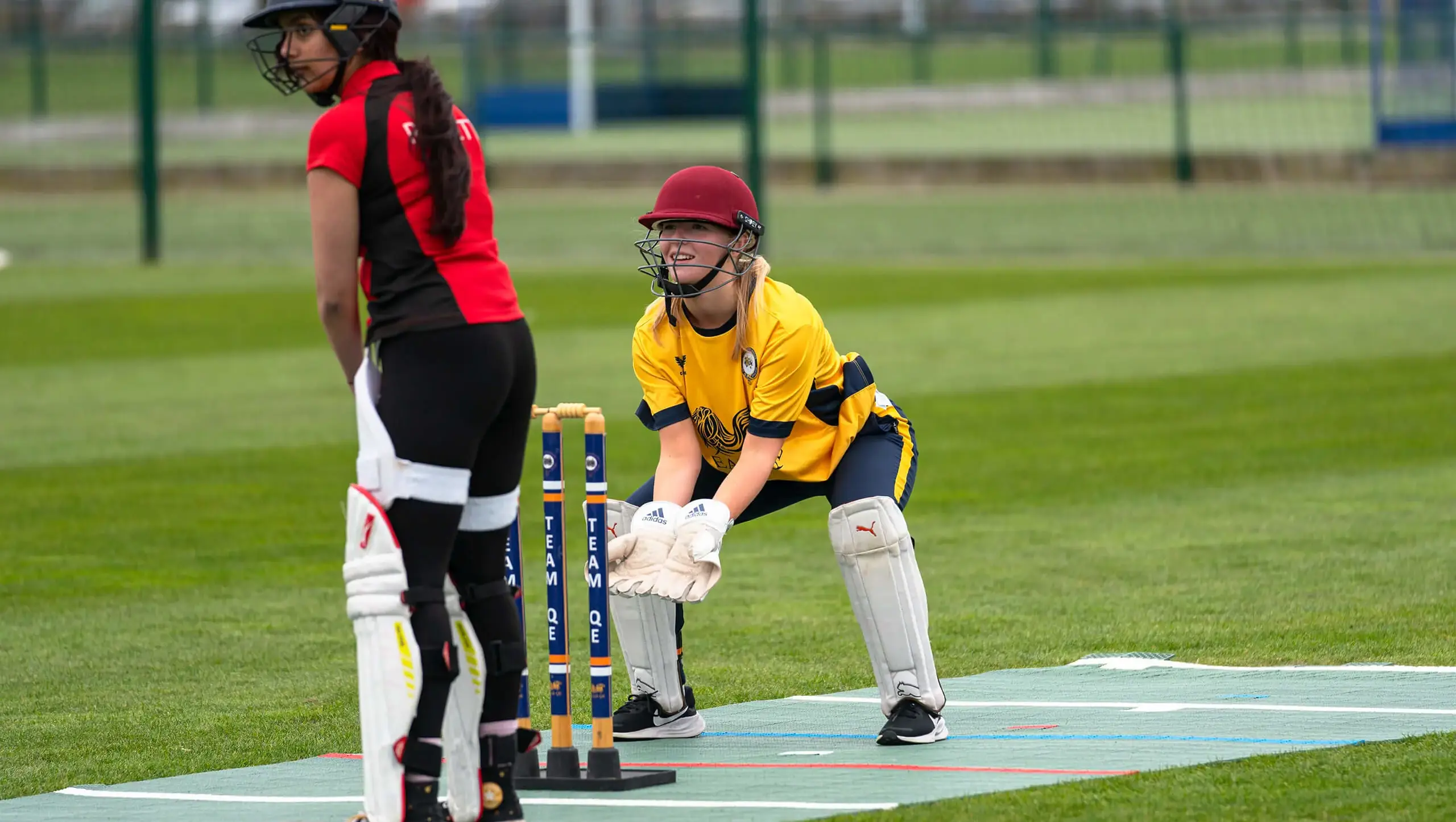 Faculty student catching a cricket ball in the new Castore kit.