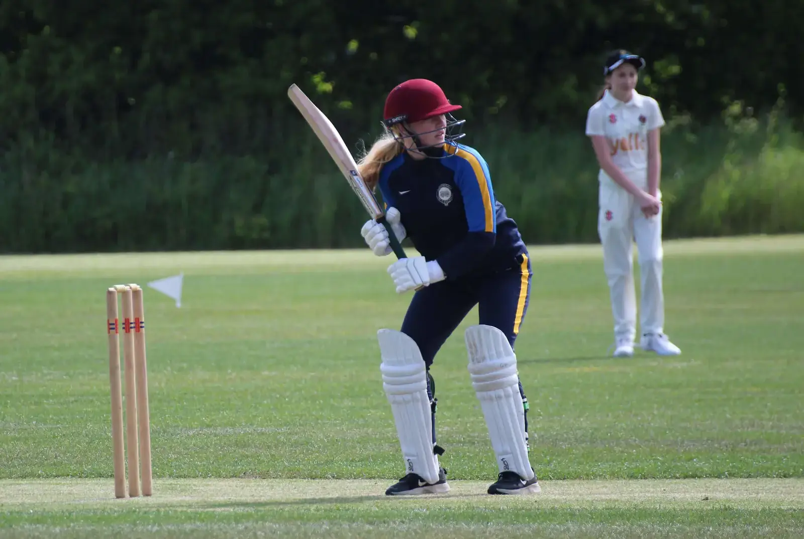 Student playing cricket at top cricket school.