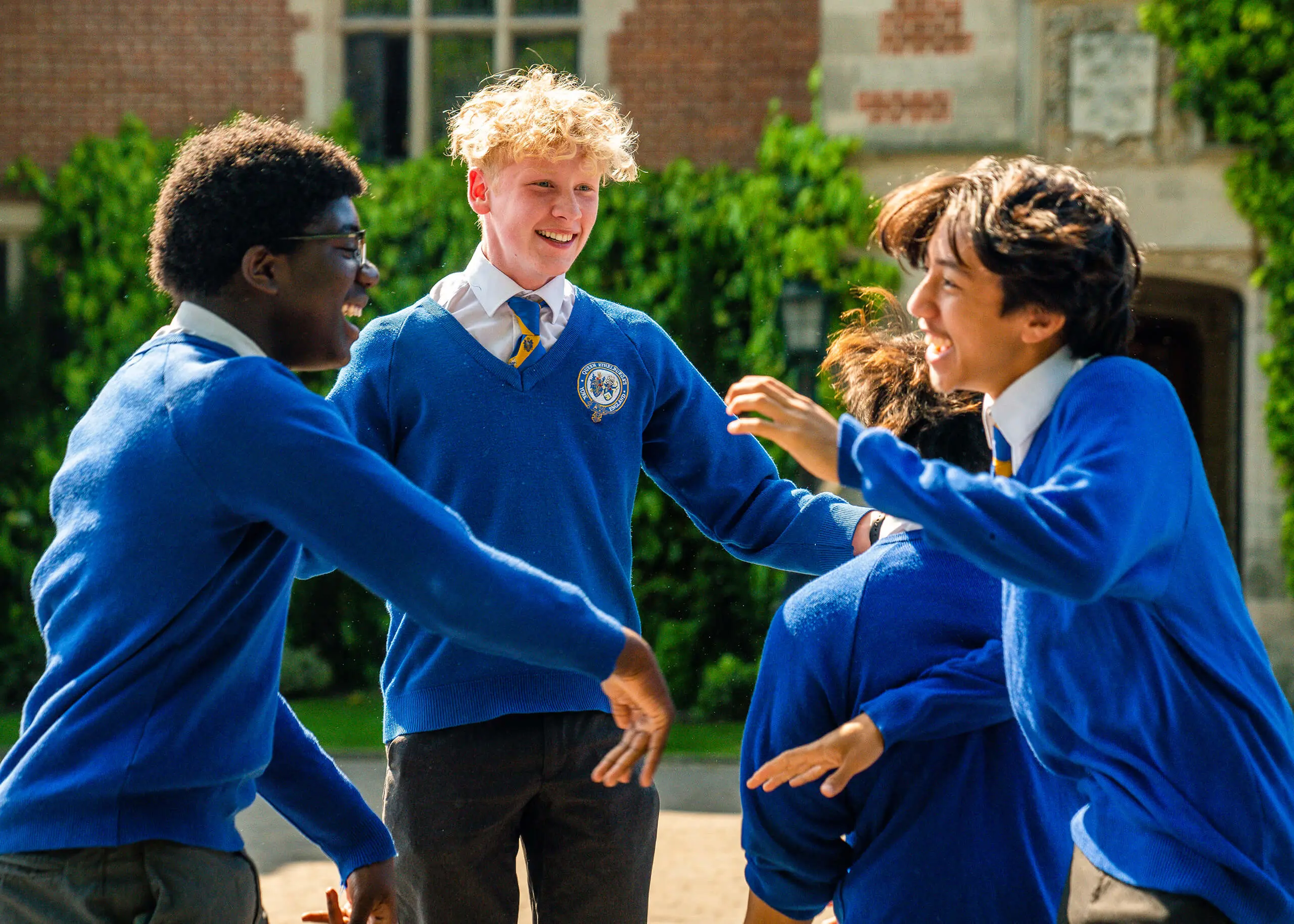 Queen Ethelburga's students celebrating GCSE results.