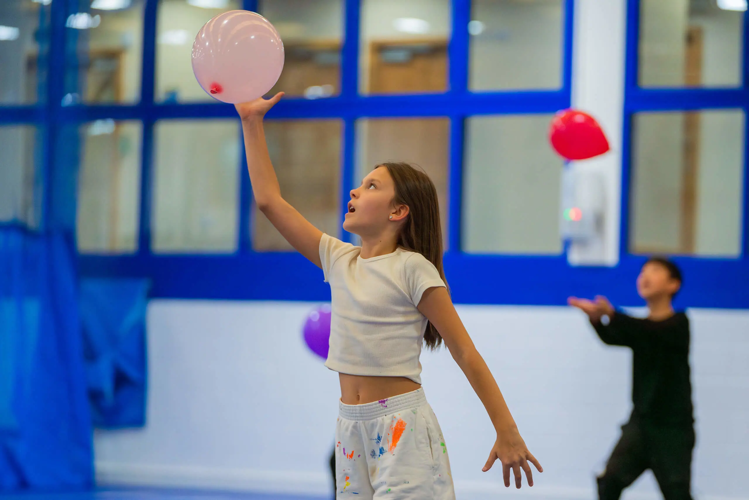 York Summer Camp student playing with a balloon.