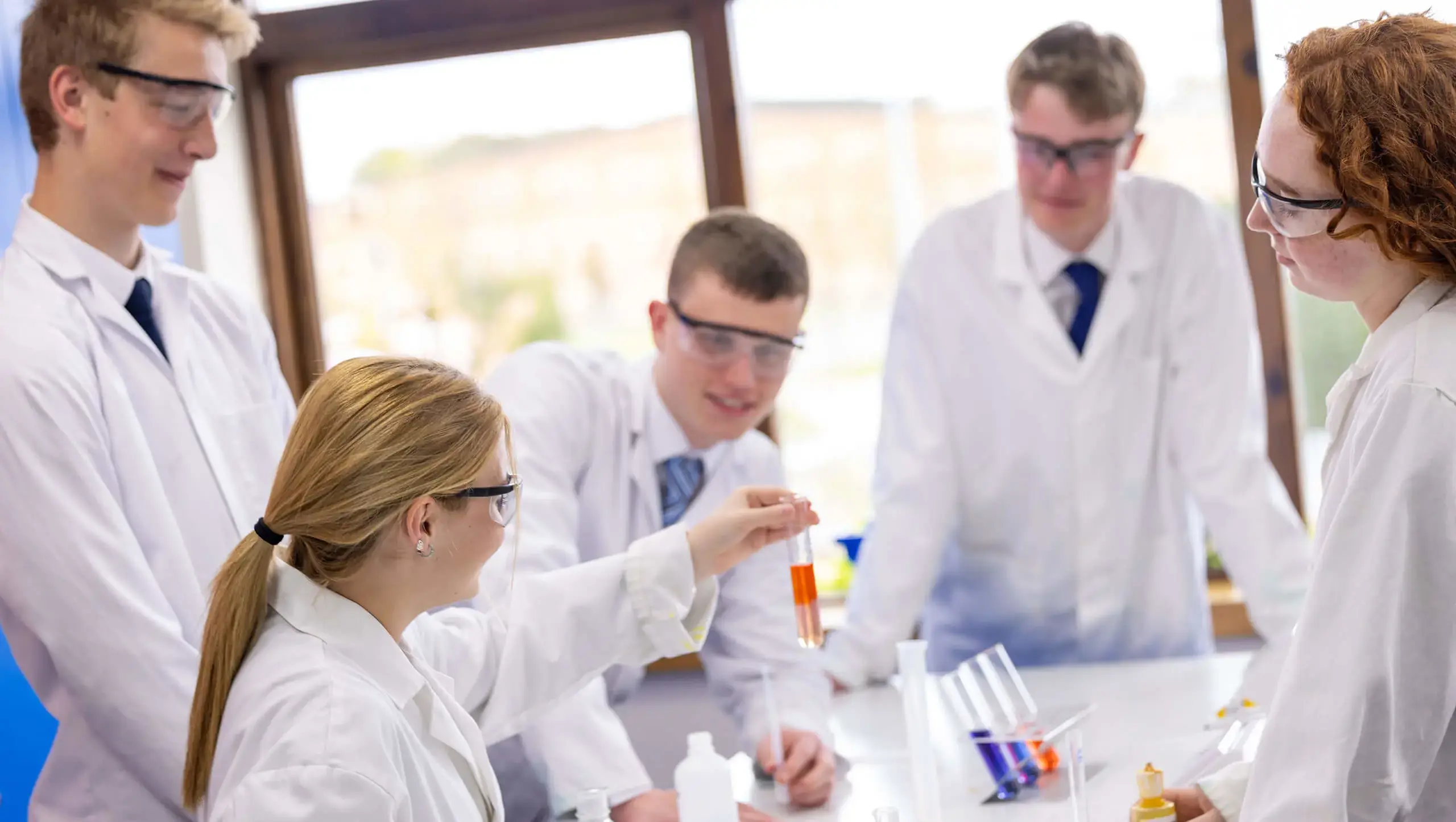 QE College students in science class at Queen Ethelburga's