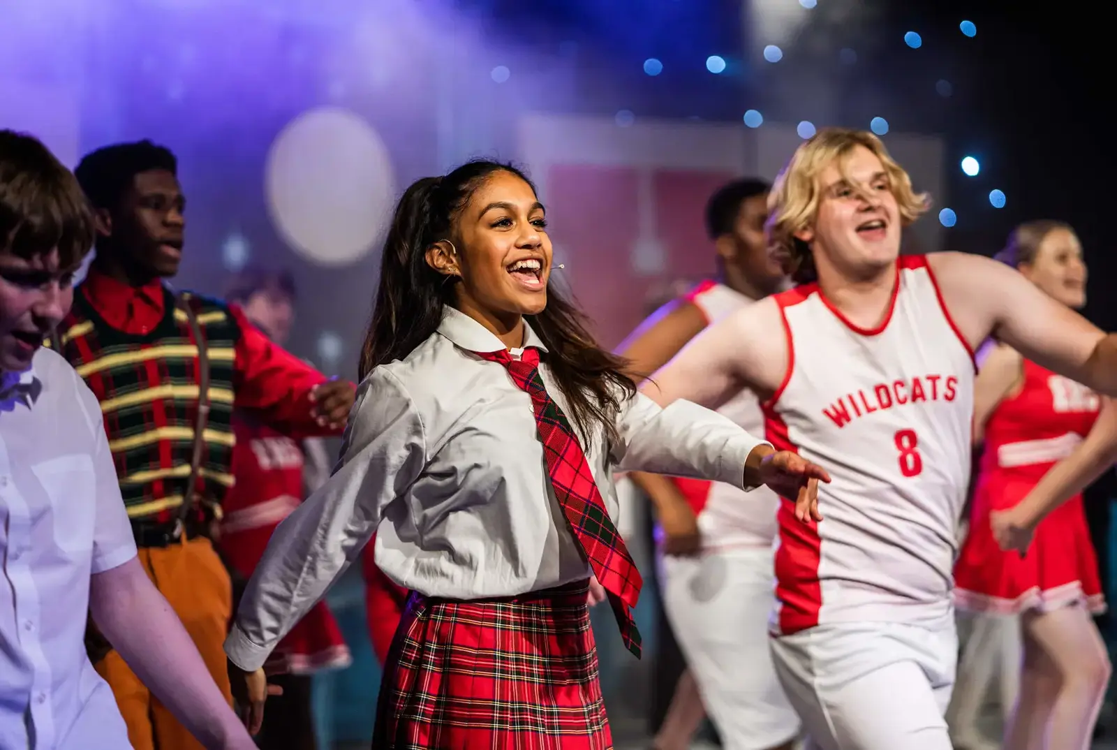 QE students performing on stage at King's Theatre