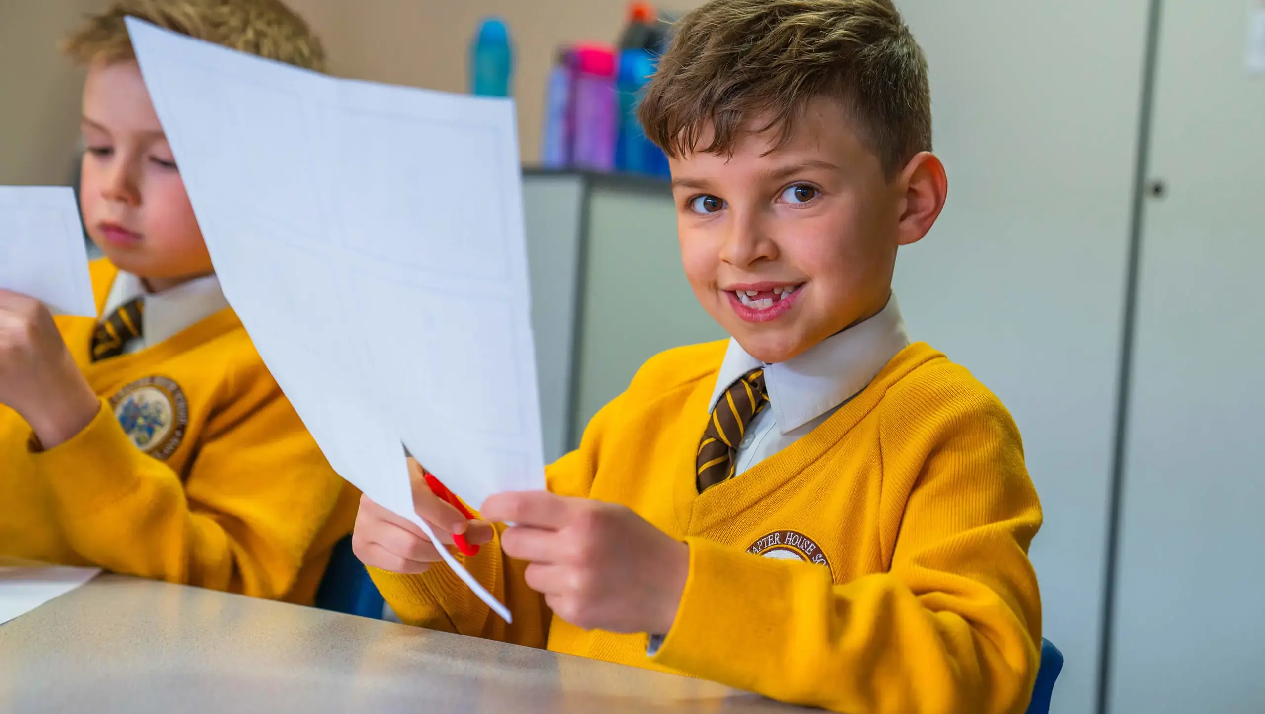 Chapter House student smiling at the camera in a modern foreign language lesson.