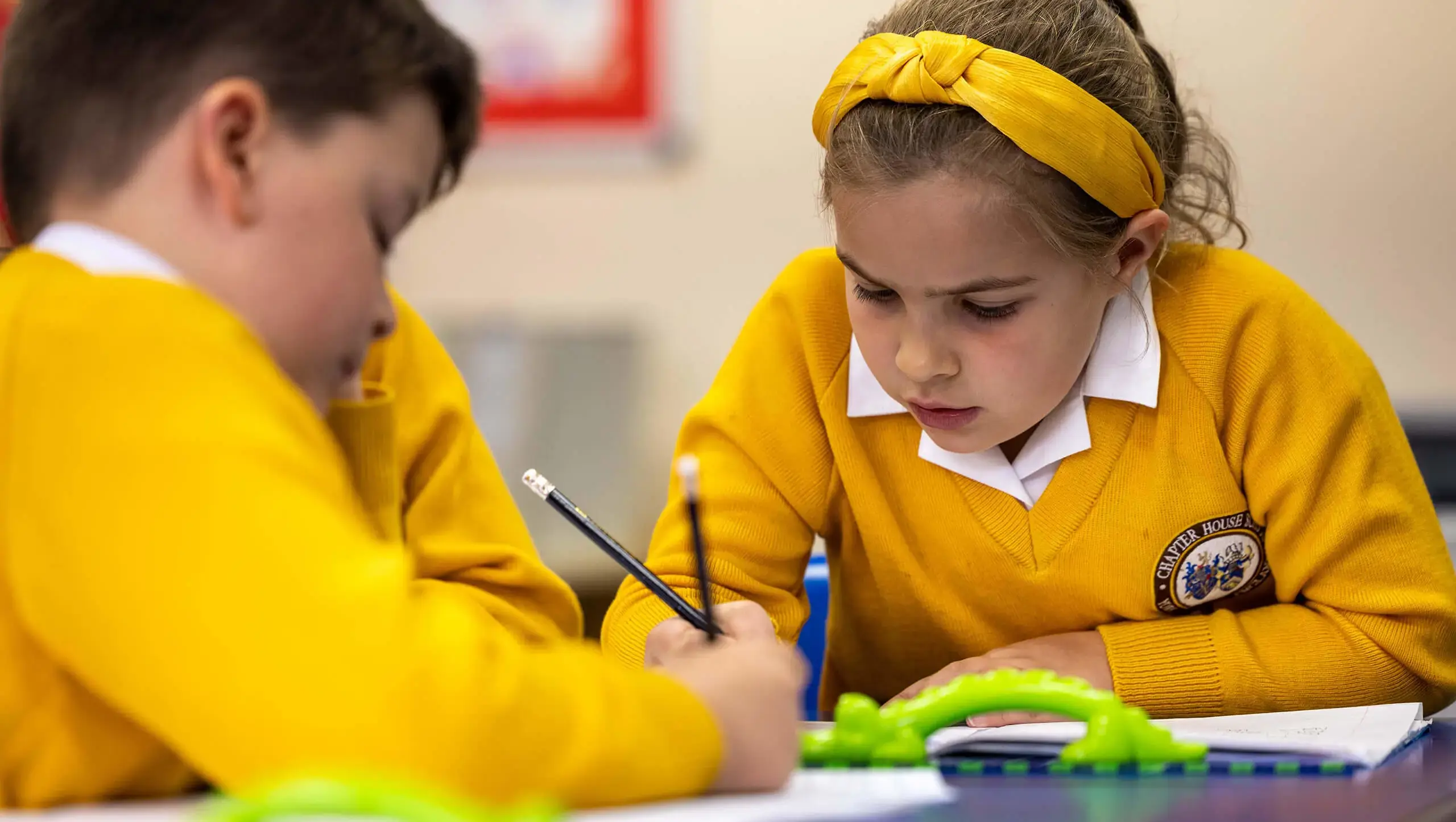 Young pupils studying in class at Chapter House