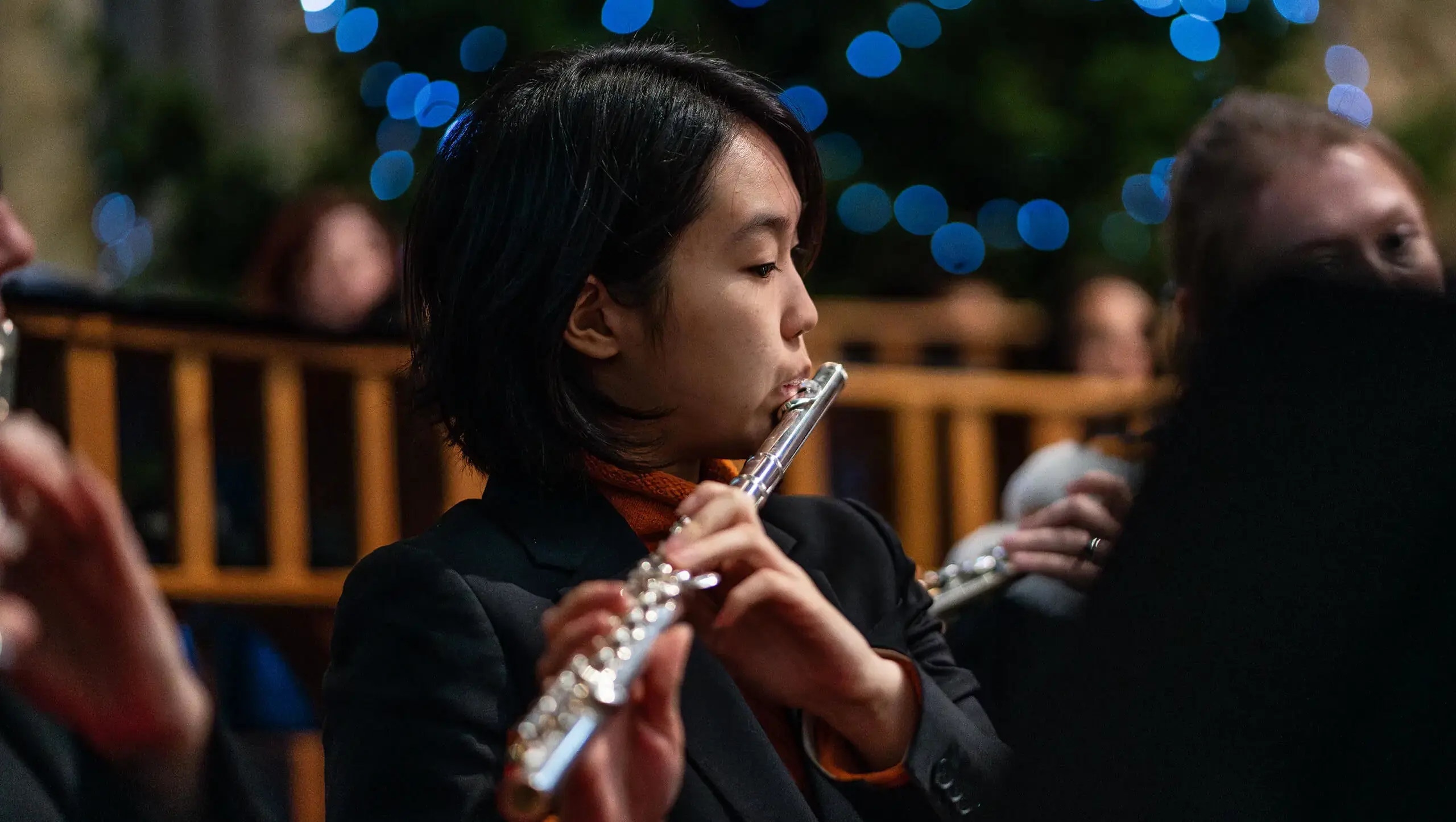 Senior School pupil at Queen Ethelburga's Collegiate playing the flute