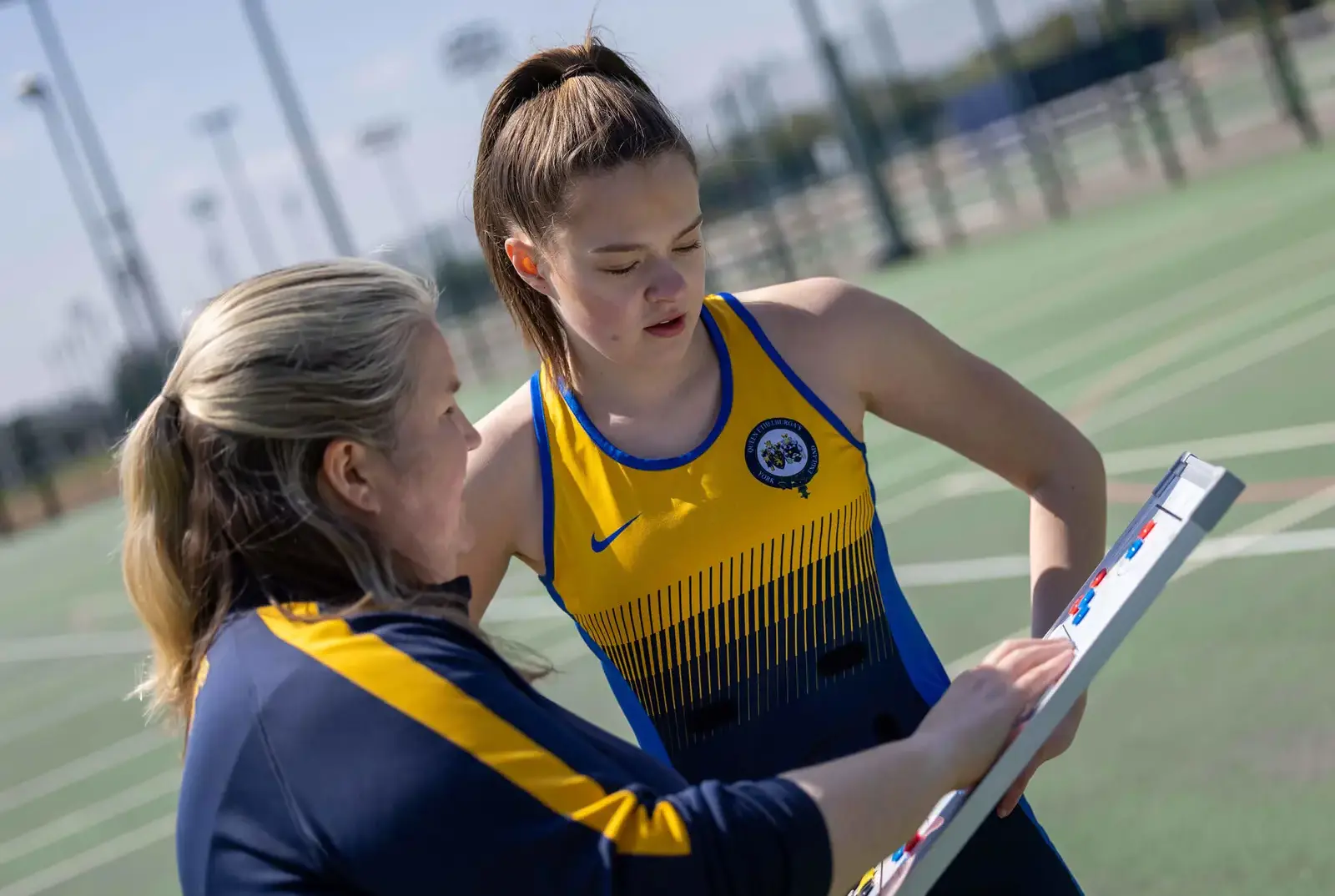 QE pupil with their netball teacher