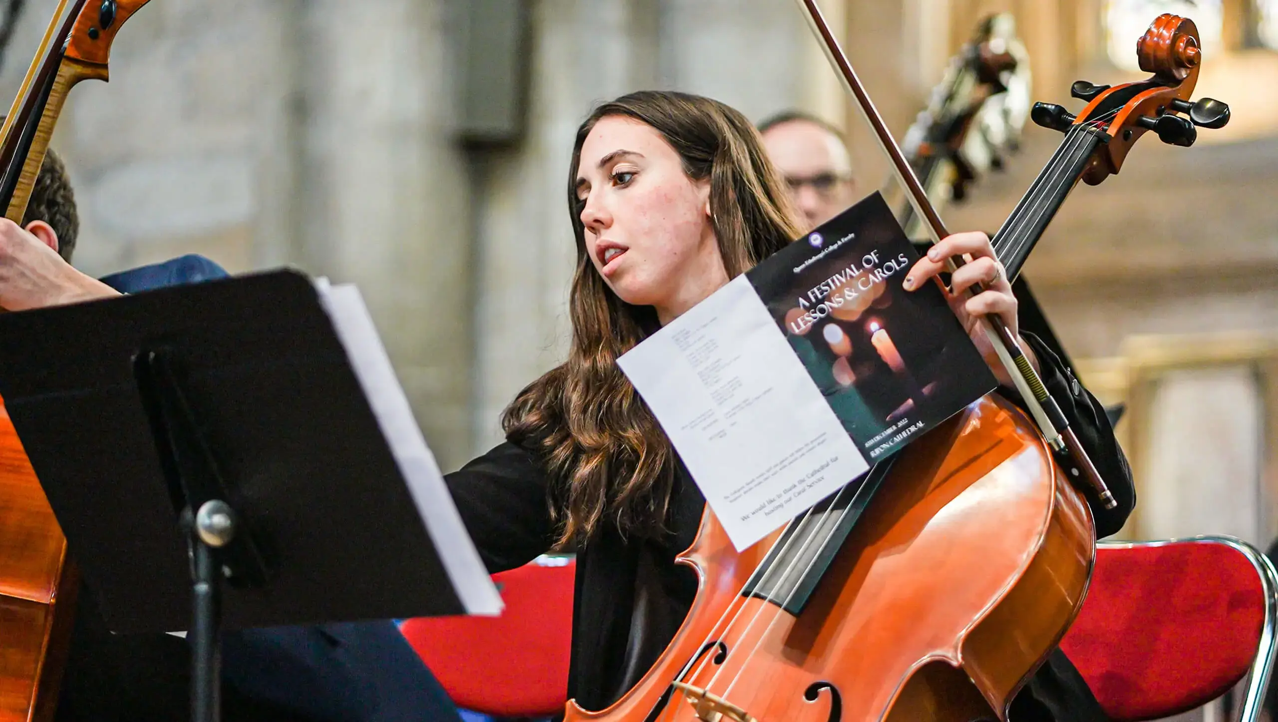 QE College student performing in the orchestra