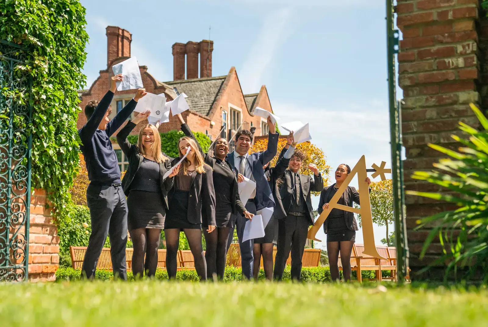 QE College pupils at Queen Ethelburga's celebrating their exam results