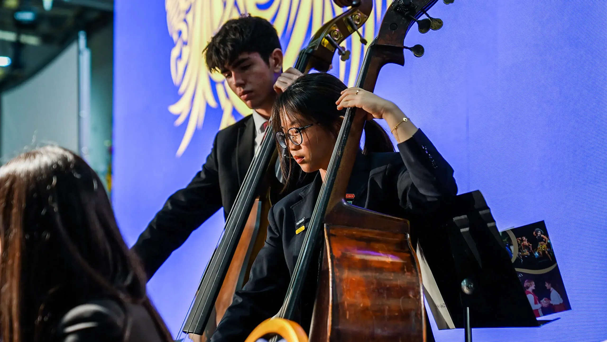 QE faculty music students performing on stage