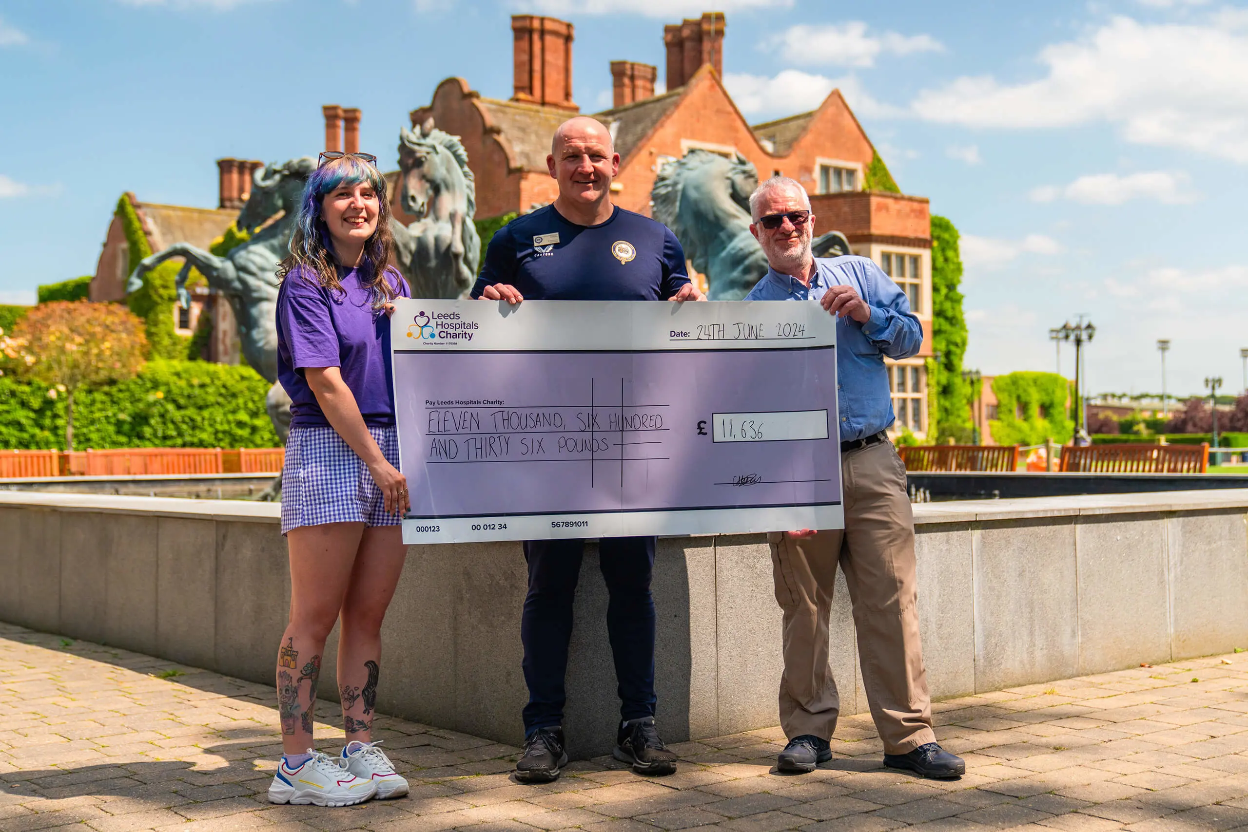 North Yorkshire Boarding School handing over a cheque to Leeds Hospitals Charity