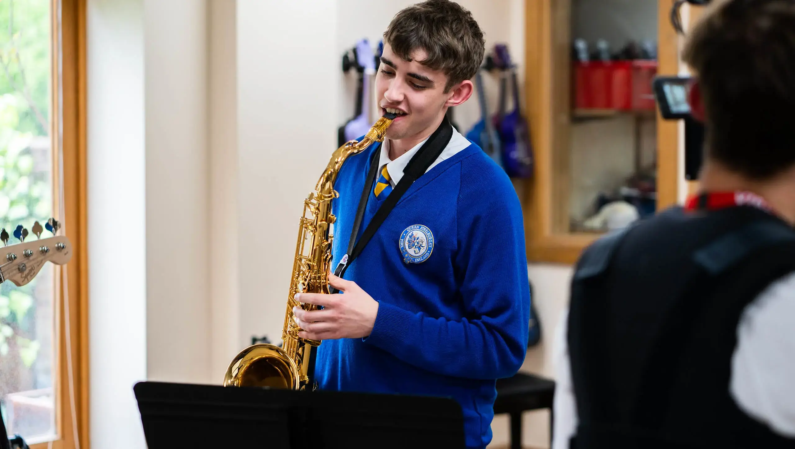 Queen Ethelburga's student playing saxophone