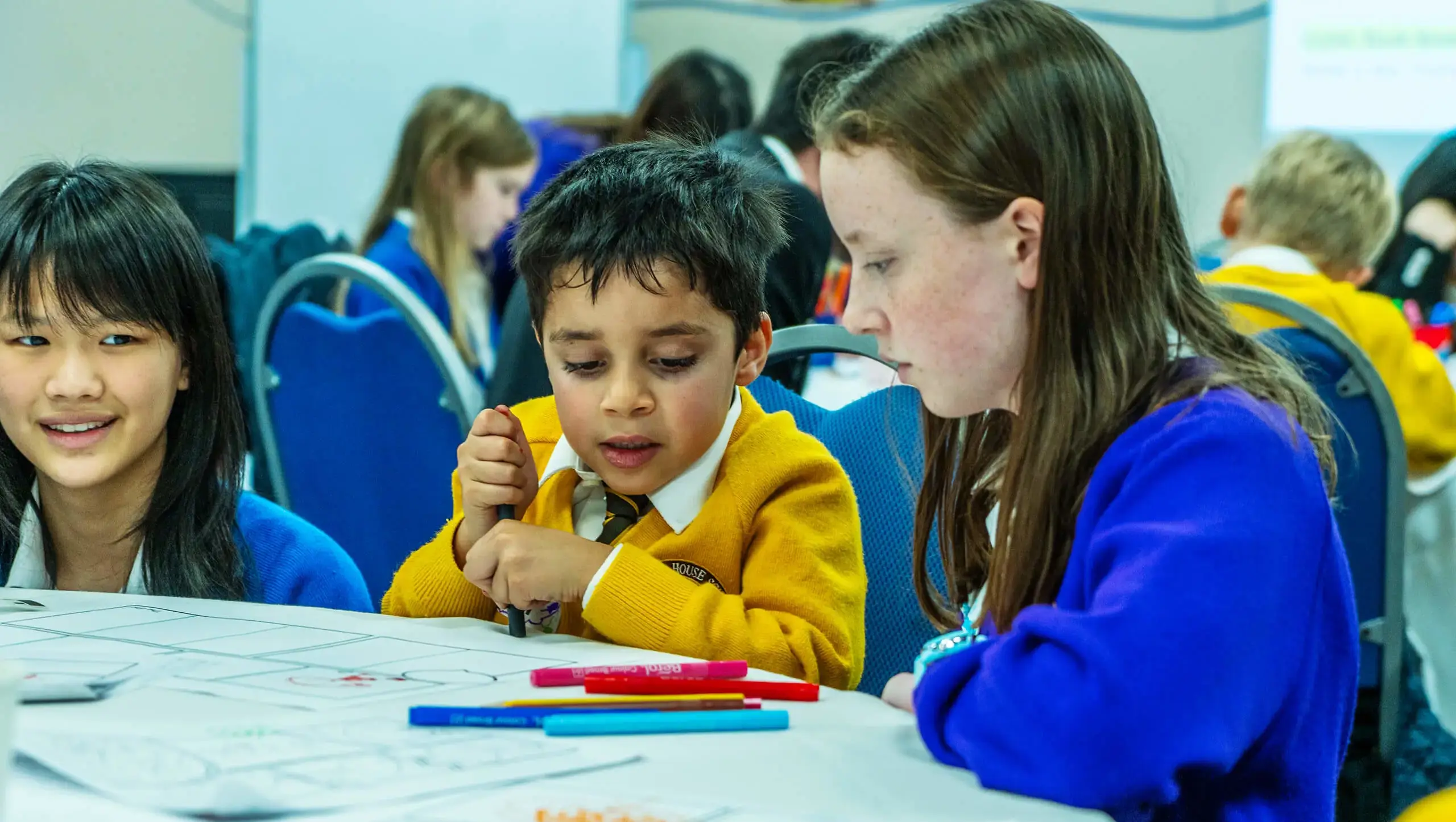 Queen Ethelburga's pupil volunteering with younger pupils